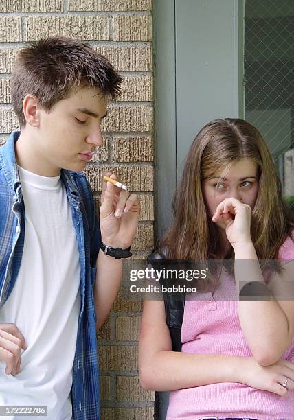 teen issues - smoking  2/3 - boys smoking cigarettes stock pictures, royalty-free photos & images