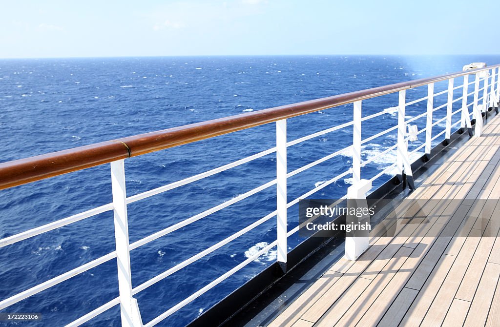Horizon view from empty cruise ship deck on a sunny day
