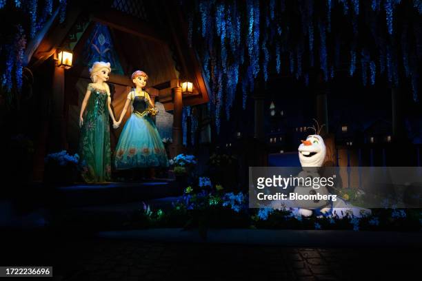 Figurines of Elsa, Anna and Olaf at the Frozen Ever After boat ride during a media event in the World of Frozen themed area at Walt Disney Co.'s...