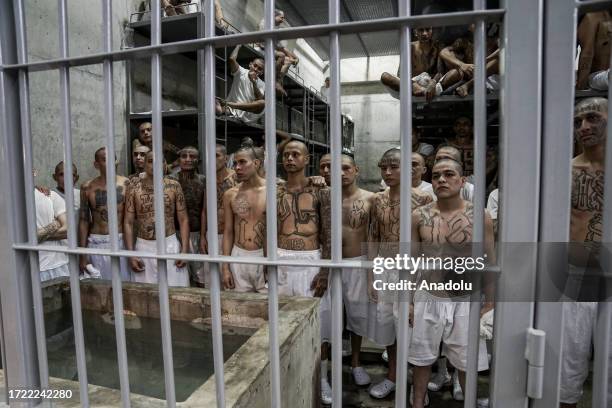 Gang members of the 'Mara Salvatrucha' and 'Barrio 18' are seen in a cell at the Terrorism Confinement Center , of the municipality of Tecoluca, in...