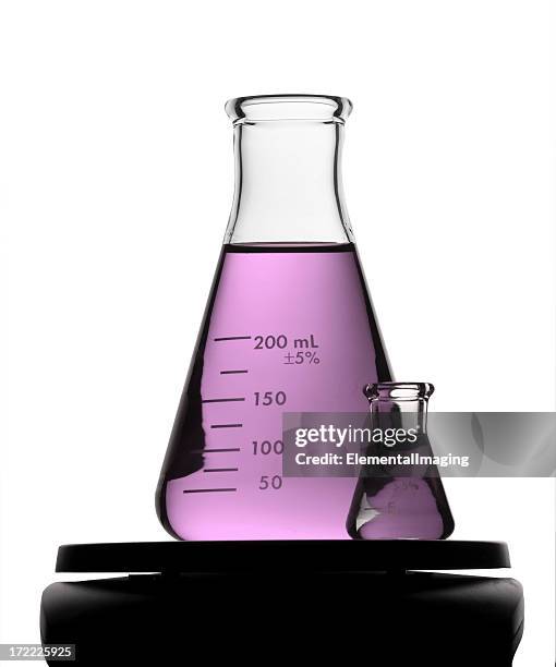 purple flask and friend. isolated on white - erlenmeyer stockfoto's en -beelden