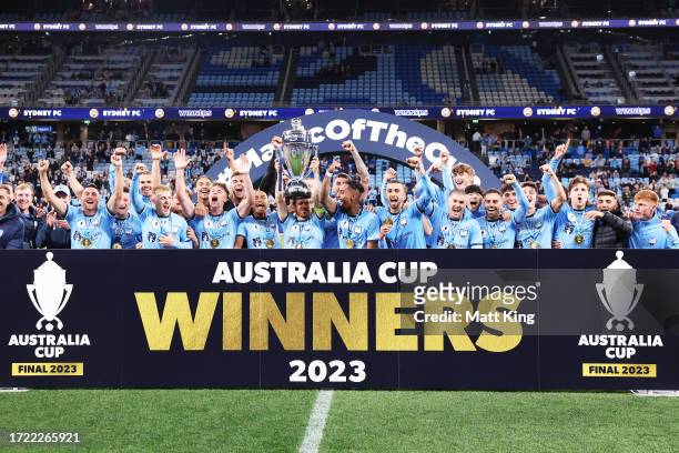 Luke Brattan of Sydney FC lifts the Australia Cup trophy and celebrates victory 1with team mates after the 2023 Australia Cup Final match between...