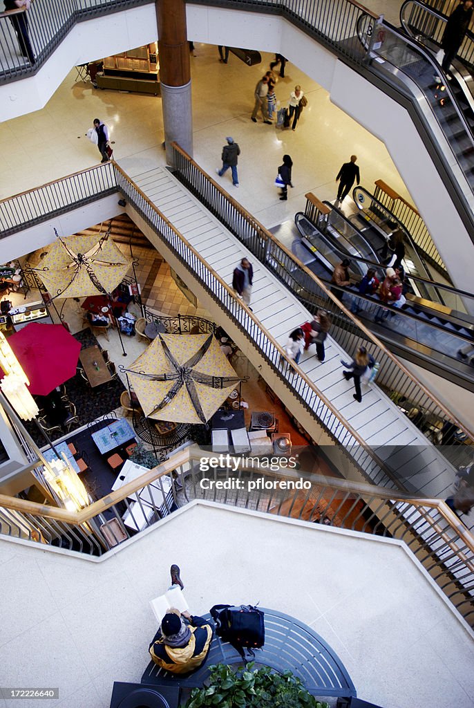 Man reading in mall