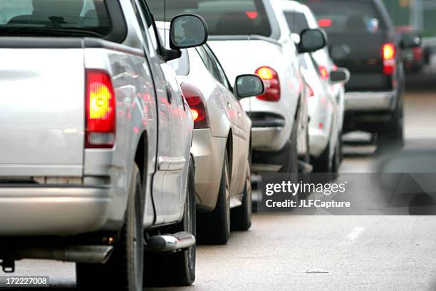 car tail lights in traffic - trucks on queue stock pictures, royalty-free photos & images