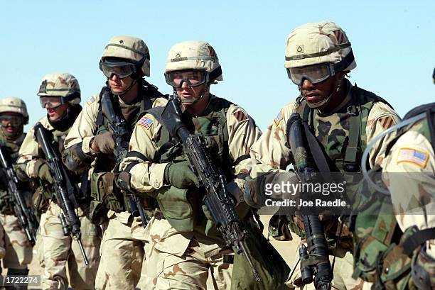 Soldiers train for urban warfare January 13, 2003 near the Iraqi Border in Kuwait. The exercises are intended to sharpen the battle readiness of the...
