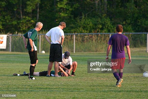 injured player - injured football player stock pictures, royalty-free photos & images