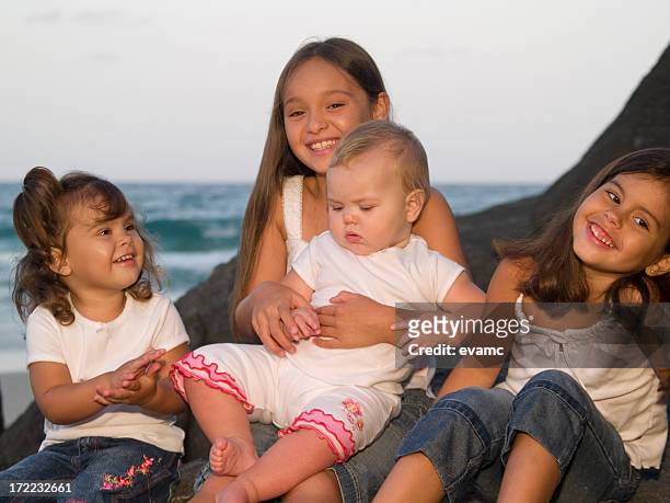 family at the beach - baby attitude stock pictures, royalty-free photos & images