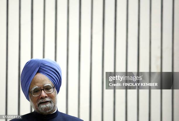 Indian Prime Minister Manmohan Singh gestures as he addresses an audience in New Delhi, 21 August 2007, during a visit by his unseen Japanese...