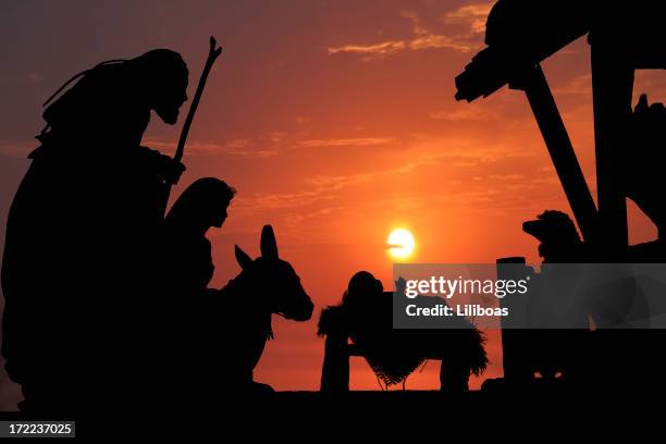 nativity (photographed silhouette) - virgin mary baby jesus stock pictures, royalty-free photos & images