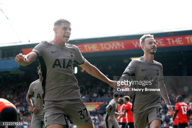 Micky van de Ven of Tottenham Hotspur celebrates with teammate James Maddison after scoring the team's first goal during the Premier League match...