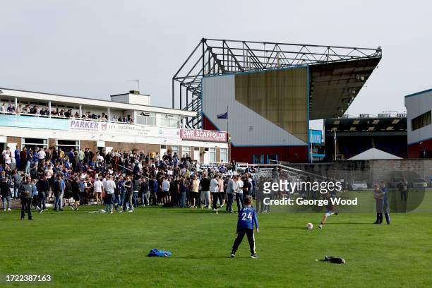 General view outside the stadium as fans are seen playing football at Burnley Cricket Club prior to the Premier League match between Burnley FC and...