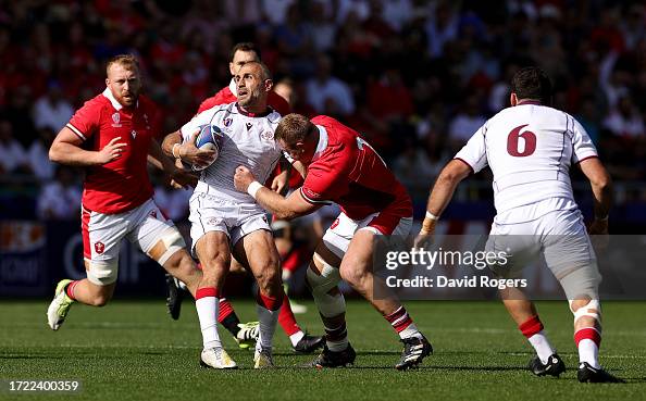Ruga Rugby Lasha Khmaladze of Georgia is tackled by Dewi Lake of Wales during ...