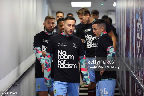 Josh Brownhill and team mates of Burnley wear 'No room for racism' shirts prior to the Premier League match between Burnley FC and Chelsea FC at Turf...