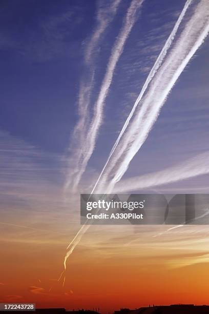contrails in the sunrise - troposphere stock pictures, royalty-free photos & images