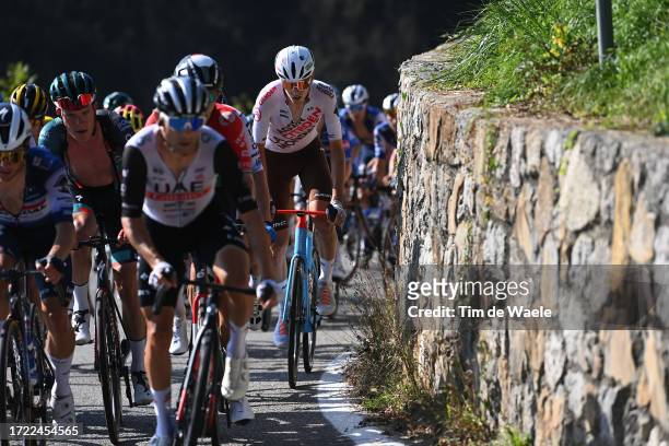 Bob Jungels of Luxembourg and Team BORA-Hansgrohe and Clement Berthet of France and Ag2R Citroen Team compete during the 117th Il Lombardia 2023 a...