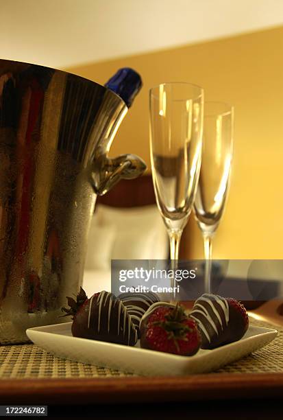 honeymoon with champagne and chocolate dipped strawberries - chocolate dipped stock pictures, royalty-free photos & images