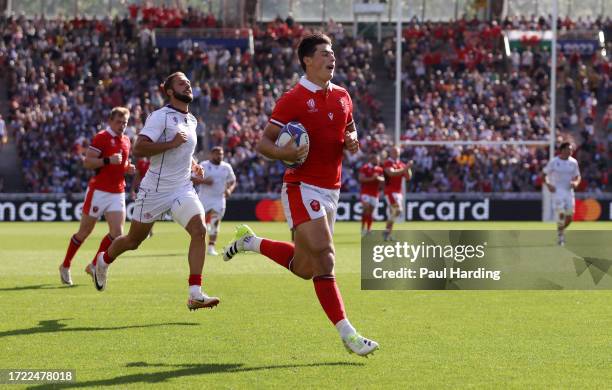 Louis Rees-Zammit of Wales makes a break to score the team's third try during the Rugby World Cup France 2023 match between Wales and Georgia at...