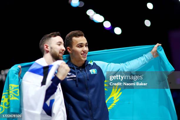 Gold medalist Artem Dolgopyat of Team Israel and bronze medalist Milad Karimi of Team Kazakhstan pose for a photo after the Men's Floor Exercise...