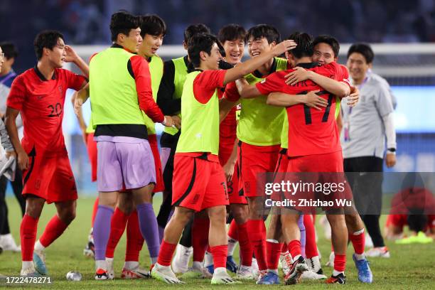 Players of South Korea celebrate the victory after the 19th Asian Game men's gold medal match between South Korea and Japan at Huanglong Sports...