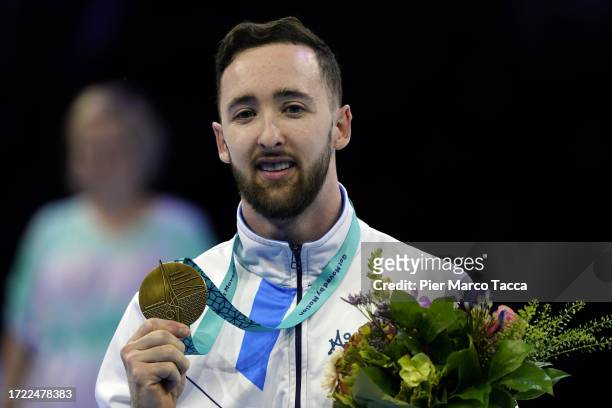 Artem Dolgopyat of Israel celebrates Gold Medal on the podium after the Men's Floor Final during day Seven of the 2023 Artistic Gymnastics World...