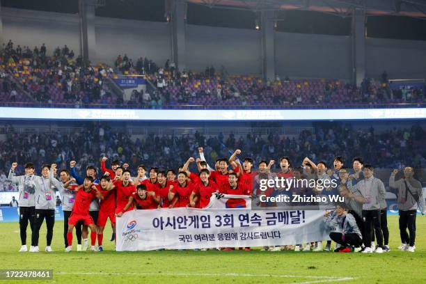 Players of South Korea celebrate the victory after the 19th Asian Game men's gold medal match between South Korea and Japan at Huanglong Sports...
