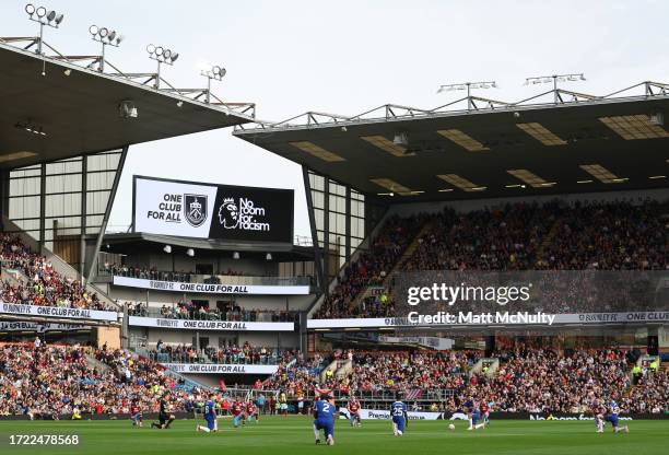 General view inside the stadium as players of both side's take the knee prior to the Premier League match between Burnley FC and Chelsea FC at Turf...