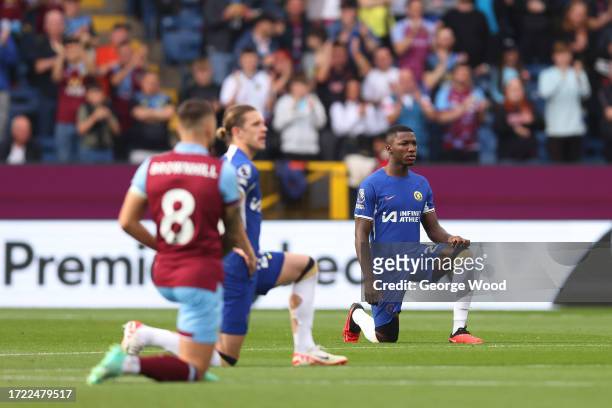 Moises Caicedo of Chelsea takes a knee in support of the Black Lives Matter movement prior to the Premier League match between Burnley FC and Chelsea...