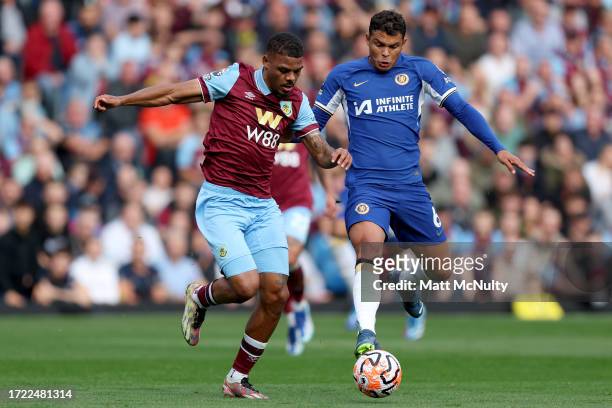 Lyle Foster of Burnley is challenged by Thiago Silva of Chelsea during the Premier League match between Burnley FC and Chelsea FC at Turf Moor on...