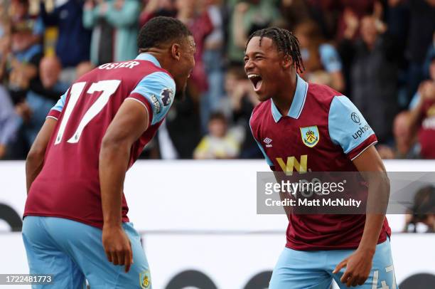 Wilson Odobert of Burnley celebrates with team mate Lyle Foster after scoring their sides first goal during the Premier League match between Burnley...