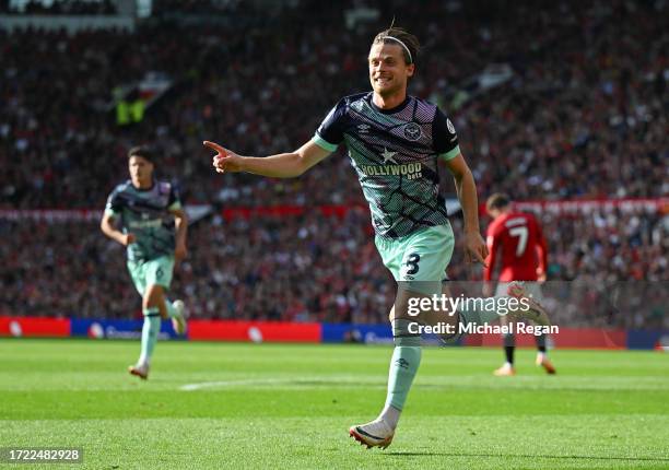 Mathias Jensen of Brentford celebrates after scoring their sides first goal during the Premier League match between Manchester United and Brentford...