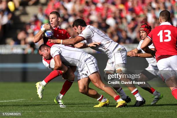 Liam Williams of Wales is tackled by Merab Sharikadze and Mikheil Gachechiladze of Georgia during the Rugby World Cup France 2023 match between Wales...