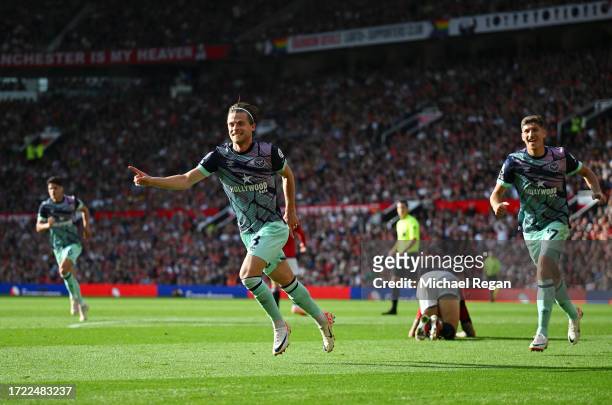 Mathias Jensen of Brentford celebrates after scoring their sides first goal during the Premier League match between Manchester United and Brentford...