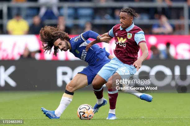Marc Cucurella of Chelsea is challenged by Wilson Odobert of Burnley during the Premier League match between Burnley FC and Chelsea FC at Turf Moor...