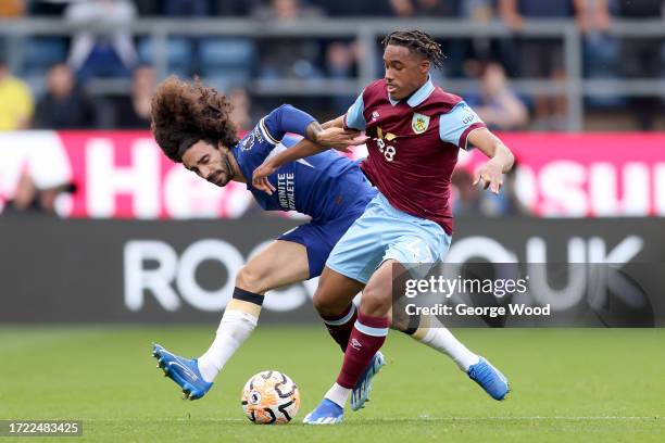 Marc Cucurella of Chelsea battles for possession with Wilson Odobert of Burnley during the Premier League match between Burnley FC and Chelsea FC at...