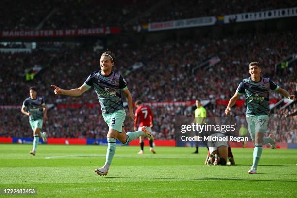 Mathias Jensen of Brentford celebrates after scoring their sides first goal during the Premier League match between Manchester United and Brentford...