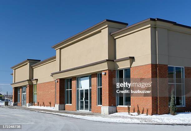 stores building entrance in winter - market retail space stockfoto's en -beelden