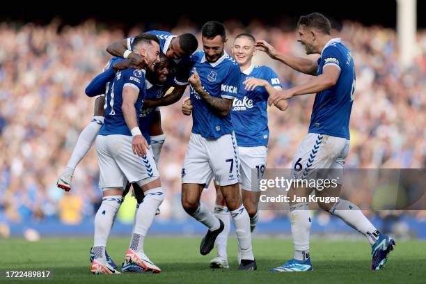 Jack Harrison of Everton celebrates with teammates after scoring the team's second goal during the Premier League match between Everton FC and AFC...