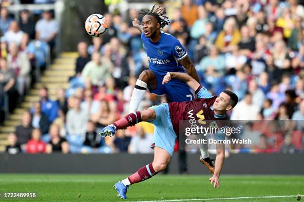 Raheem Sterling of Chelsea is challenged by Josh Cullen of Burnley during the Premier League match between Burnley FC and Chelsea FC at Turf Moor on...