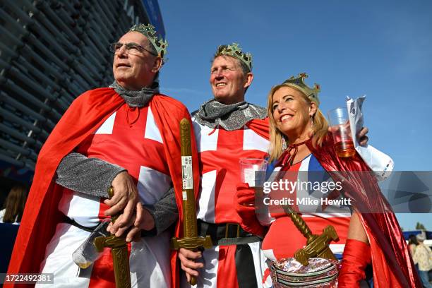 Fans of England, wearing fancy dress costumes, pose for a photo on the outside of the stadium prior to the Rugby World Cup France 2023 match between...