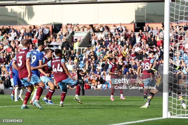 Ameen Al-Dakhil of Burnley scores their sides own goal during the Premier League match between Burnley FC and Chelsea FC at Turf Moor on October 07,...