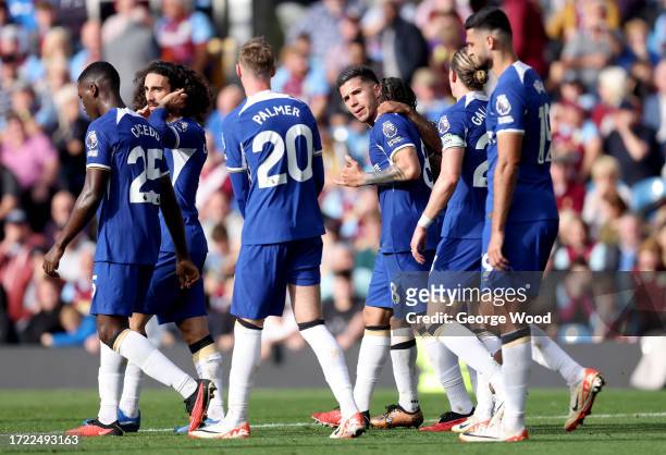 Enzo Fernandez and team mates of Chelsea celebrate after Ameen Al-Dakhil of Burnley scores their sides own goal during the Premier League match...