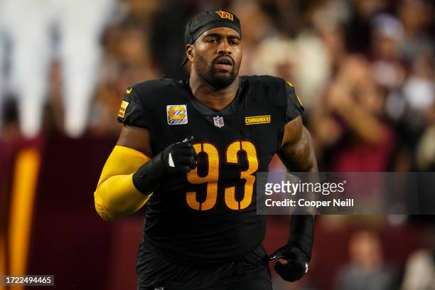 Jonathan Allen of the Washington Commanders runs out of the tunnel prior to an NFL game against the Chicago Bears at FedEx Field on October 5, 2023...