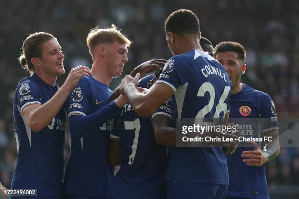 Raheem Sterling, Cole Palmer and team mates of Chelsea celebrate after Ameen Al-Dakhil of Burnley scores their sides own goal during the Premier...