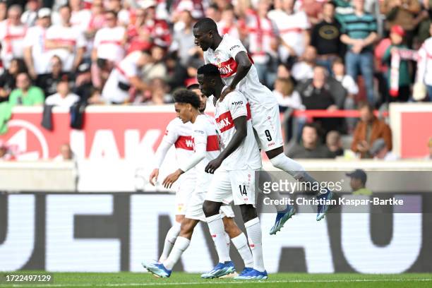 Sehrou Guirassy of VfB Stuttgart celebrates with teammates after scoring the team's first goalfrom a penalty during the Bundesliga match between VfB...