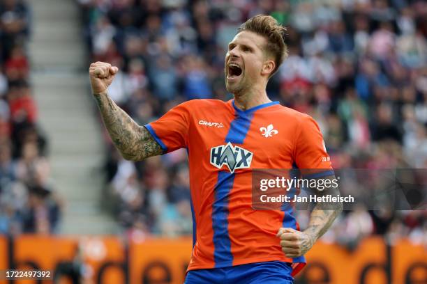 Tobias Kempe of SV Darmstadt 98 celebrates after scoring their sides second goal from the penalty spot during the Bundesliga match between FC...