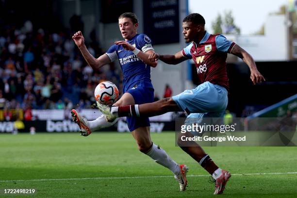 Conor Gallagher of Chelsea battles for possession with Lyle Foster of Burnley during the Premier League match between Burnley FC and Chelsea FC at...