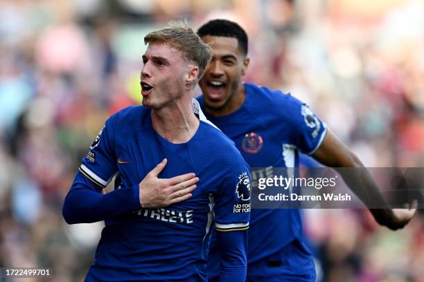 Cole Palmer of Chelsea celebrates after scoring their sides second goal from the penalty spot during the Premier League match between Burnley FC and...