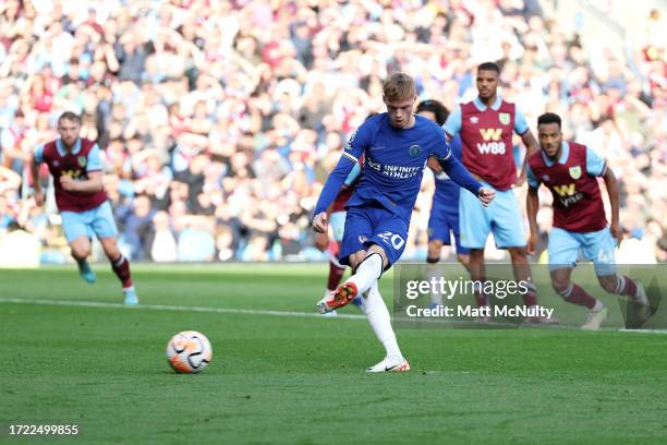 Cole Palmer of Chelsea scores their sides second goal from the penalty spot during the Premier League match between Burnley FC and Chelsea FC at Turf...