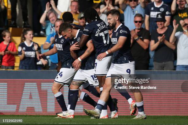 Joe Bryan of Millwall celebrates scoring their 2nd goal with his team mates during the Sky Bet Championship match between Millwall and Hull City at...