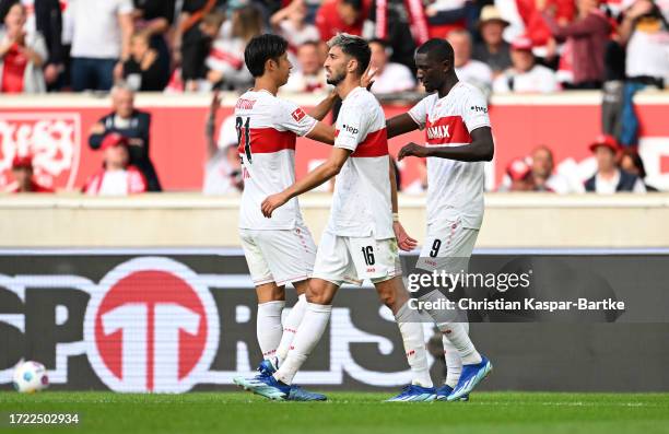 Sehrou Guirassy of VfB Stuttgart celebrates with teammates after scoring his and the team's second goal during the Bundesliga match between VfB...